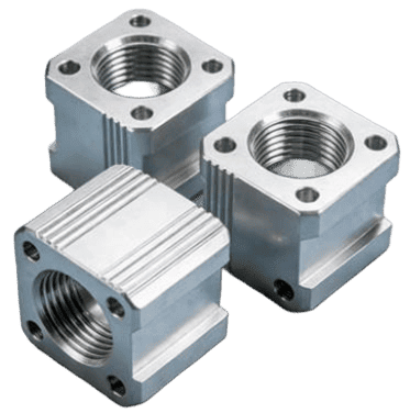 Group of small square CNC machined aluminum mounting blocks with internal threading.